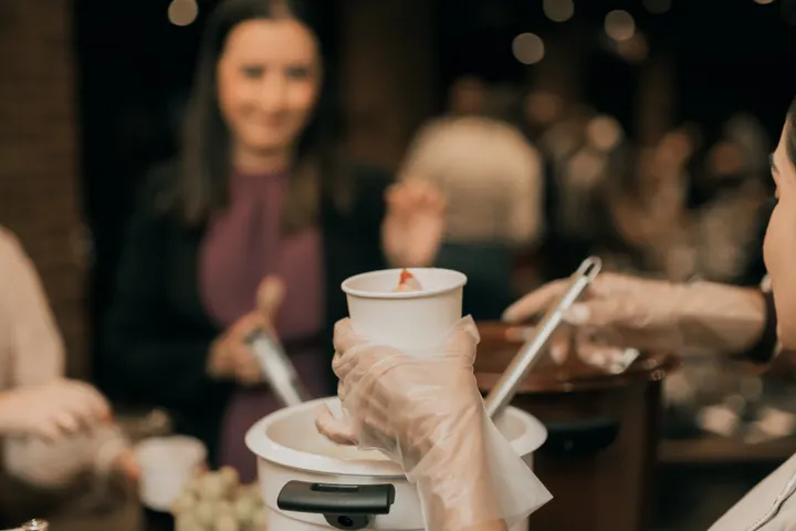 Catering staff serving food to guests at an event